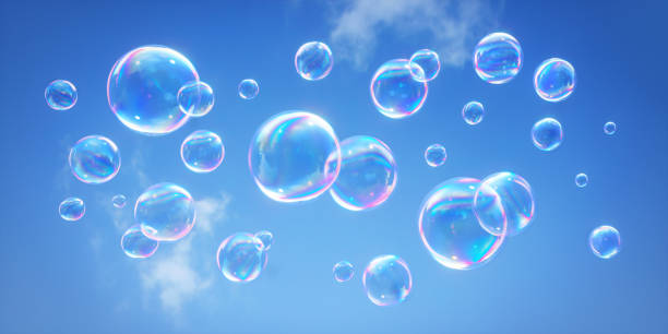 istock Soap bubbles flying in the blue sky 1253992307