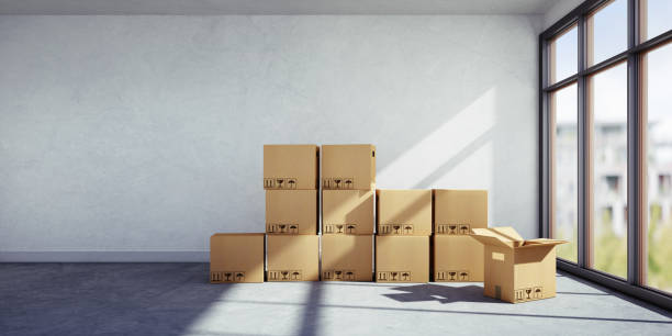 boîtes déballées dans un nouvel appartement - apartment contemporary action packing photos et images de collection