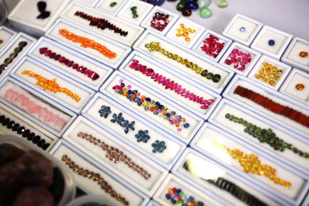 Artificial gems on white plastic box in jewelry store