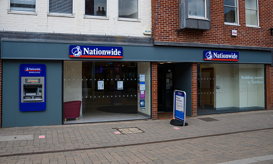 Newbury, United Kingdom - June 09 2020:  The frontage of Nationwide Building Society with social distancing markers on the pavement on Northbrook Street