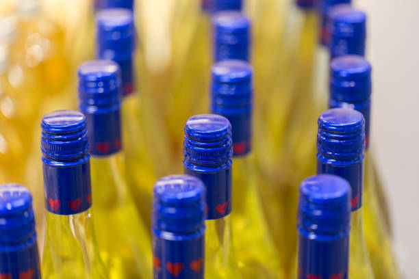 istock Close up of bottles with blue cap containing a yellow liquid 1254003680