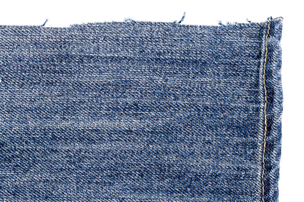 istock Piece of blue jeans fabric 1254010758