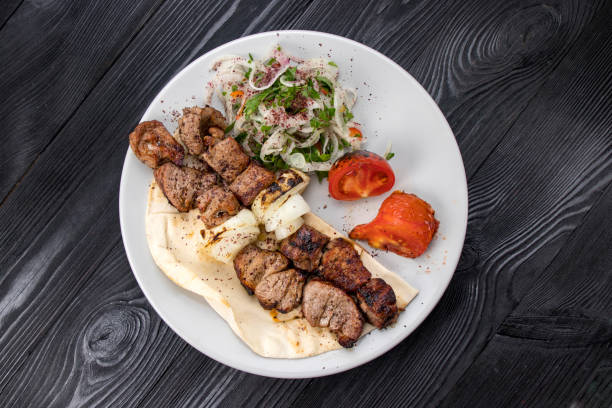 istock grilled meat on pita bread with salad 1254011918