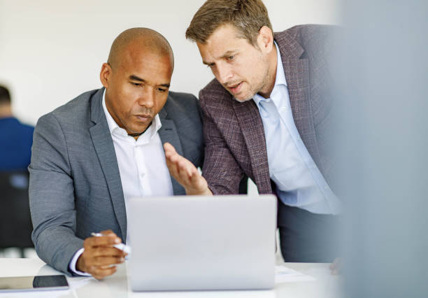 istock Male entrepreneurs working on laptop in the office. 1254014427