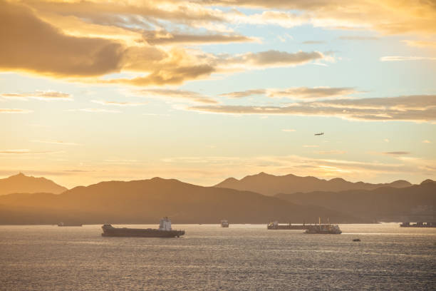 istock Container ships in ocean, South China Sea, Sunset, wide angle 1254014833