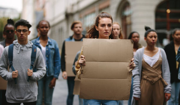 istock Protestors doing demonstration on the street holding sign boards 1254016368