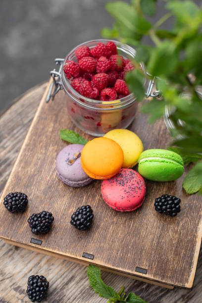 istock macaroons with berries on a wooden table 1254016503