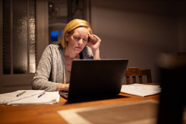 istock Woman looking disappointed while working from home 1254026713
