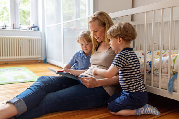 istock Mother reading a storybook with her children 1254026767
