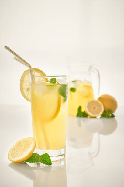 istock Pitcher of lemonade with mint on white background 1254027357