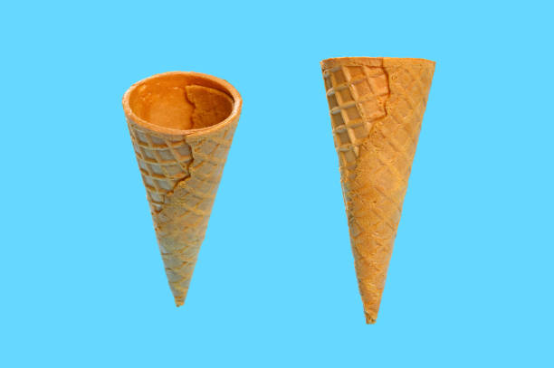 istock two angle views of empty ice cream cone on a blue background 1254027469
