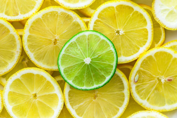 istock Lemon slices with one cut lime slice closeup 1254034424