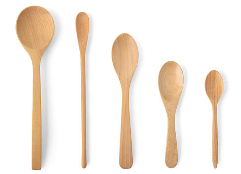 Top view Wooden spoon different sizes isolated on white background. Kitchenware set concept