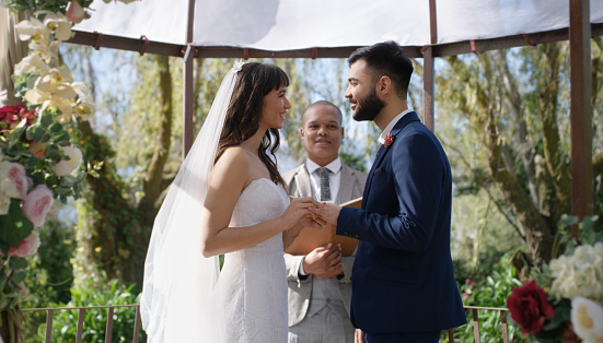Shot of a happy young couple getting married in a garden