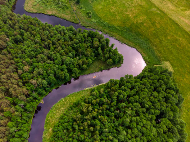 istock rural landscape with a small meandering river (aerial view) 1254037829