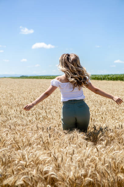 istock Blonde woman in the grain 1254037849