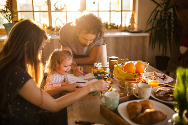istock Lovely parents spending creative morning during weekend with their toddler 1254039792