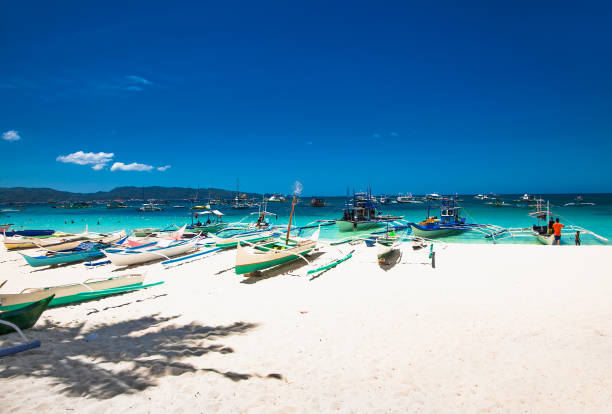 istock Boat at famous White Beach on Boracay Island, Philippines 1254041196