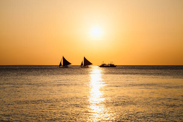 istock Philippine traditional boat sailing in sunset. Boracay, Philippines. 1254041230