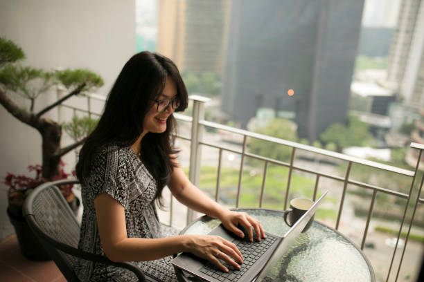 istock asian beautiful woman using laptop and working from home 1254046009