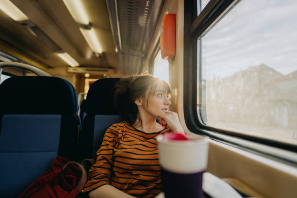 istock Young woman on a train 1254046650