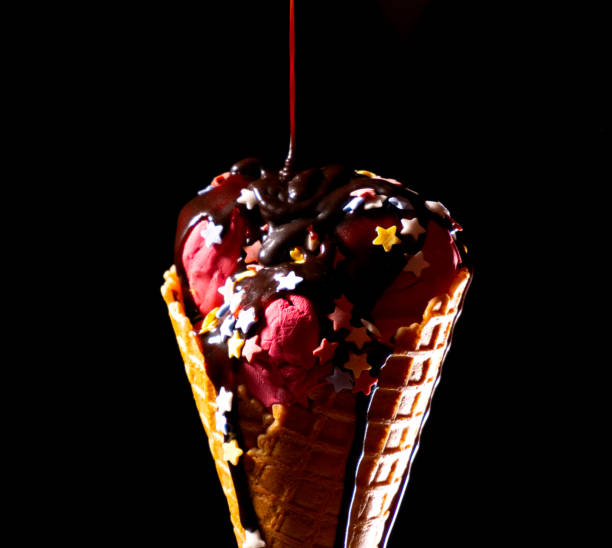 istock Closeup chocolate topping on ice cream with cherry taste 1254047249