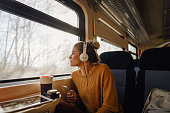 Young woman riding a train