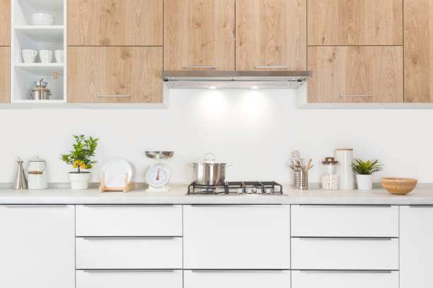 Modern kitchen furniture with gas stove, pot and various utensils Modern kitchen furniture with gas stove, pot and various utensils vintage kitchen scale with fruit stock pictures, royalty-free photos & images