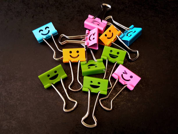 istock Smiling Face Happy Different Colors Metal Binder Clips 1254049363