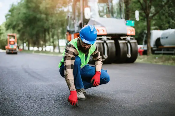 Photo of Road construction worker on job