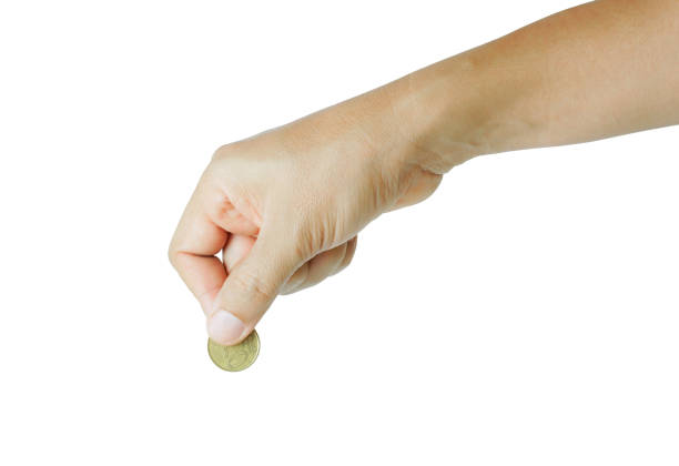 istock Hand holding a coin 1254050479