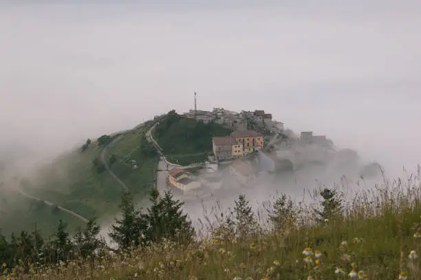 Photo of Aerial view of Castelluccio di Norcia with fog at sunrise