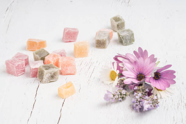 istock Turkish delights and spring flowers on a table with copy space 1254054597