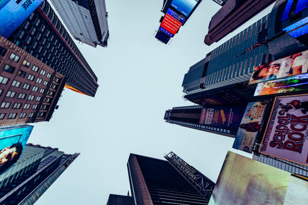 istock Low Angle View of Skyscrapers in Times Square at Dusk 1254055806