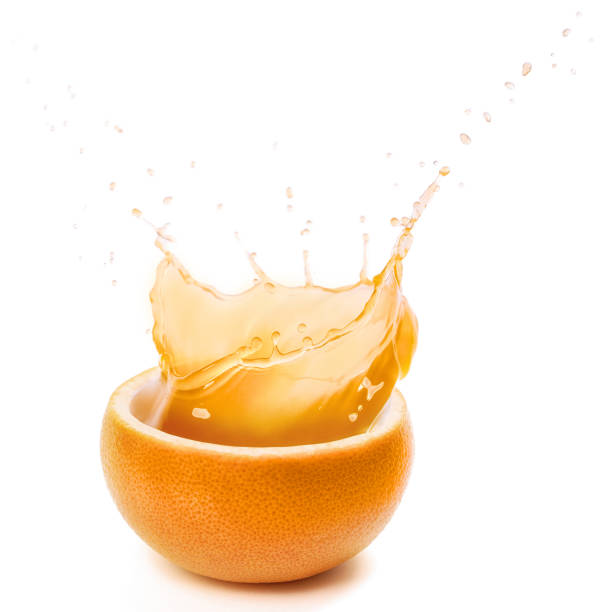 istock cut orange juice splashing isolated on white 1254059000
