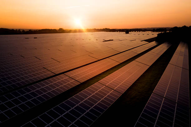 istock Sunrise over a modern solar farm 1254060780