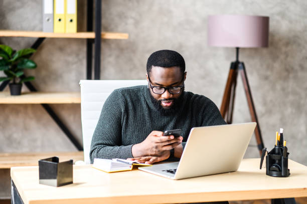 istock An African-American guy using laptop in the office 1254062257