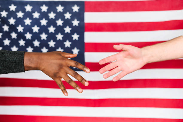 istock black and white males shaking hands 1254062347