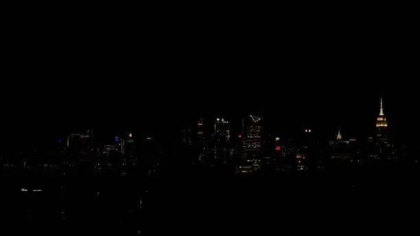 NYC skyline on balmy night with all its twinkling lights taken from a hill in New Jersey.