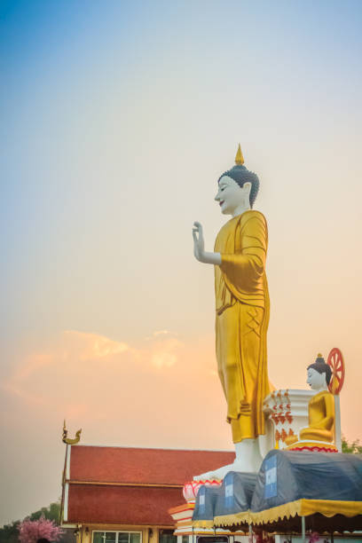 istock Beautiful big buddha image at Wat Phra That Doi Kham. Chiang Mai, Thailand. Wat Phra That Doi Kham (Wat Doi Kham or the Golden temple) is located at the top of a hill to the south west of the city. 1254063898