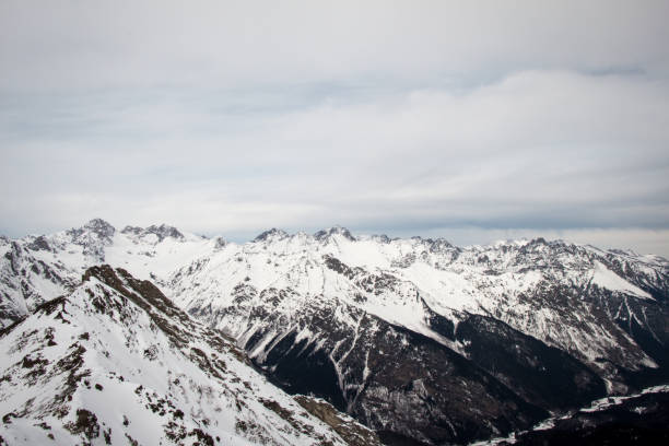 istock Mountain landscape of snowy Dombay 1254065049