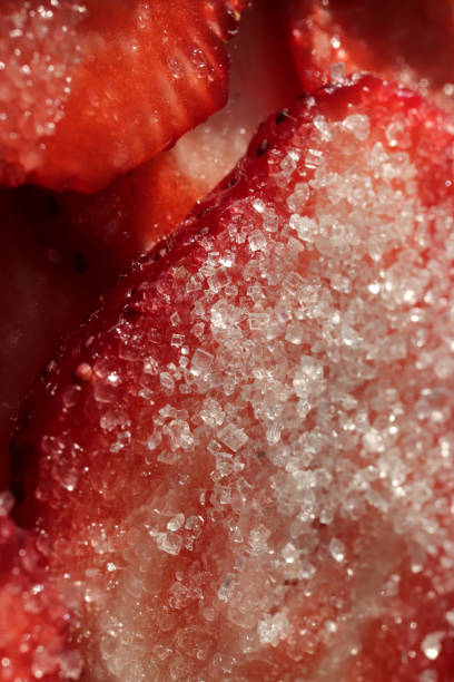 Strawberry slice with sugar. Sweet Berry background. Tasty delicious background.