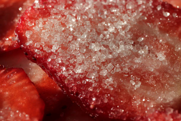 Strawberry slice with sugar. Sweet Berry background. Tasty delicious background.