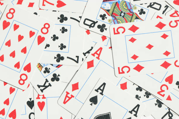 istock Assorted play cards backdrop. Many miscellaneous jumbled playing cards surface. Mixed playing cards background. 1254066805