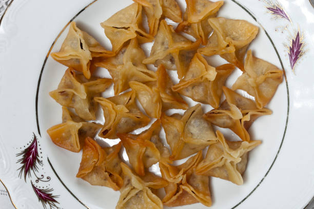 istock Traditional rice ravioli (manti) on a white porcelain plate. 1254068034