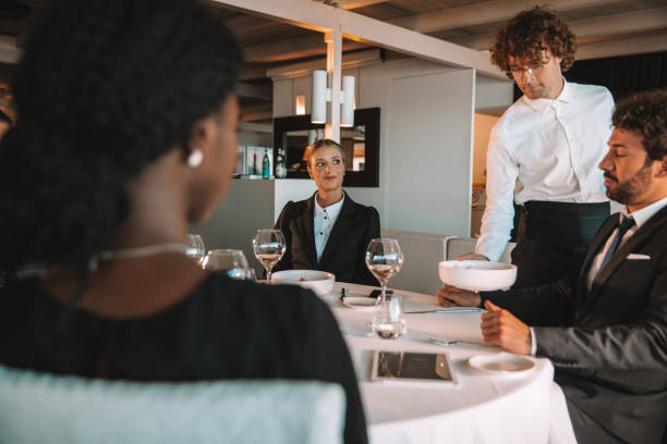 istock Business people dining in a luxury restaurant 1254069129