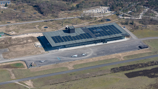 Soesterberg, The Netherlands - March 2020: Aerial photo Military Museum with American war planes on the apron.