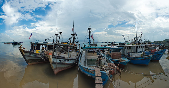 Sandakan. Malaysia. November 27, 2018. Large fishing boats are moored at the fish market pier on the East coast of Borneo.