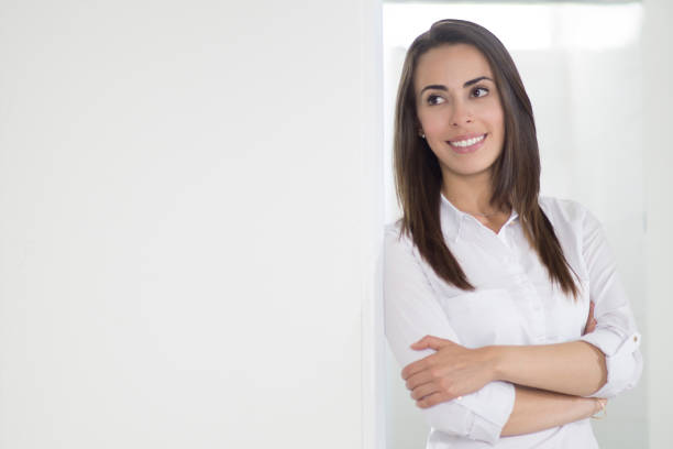 istock Young woman thinking about the future looking away 1254074060
