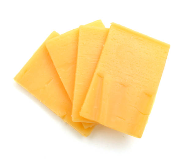 istock sliced of cheddar cheese isolated on white 1254074284